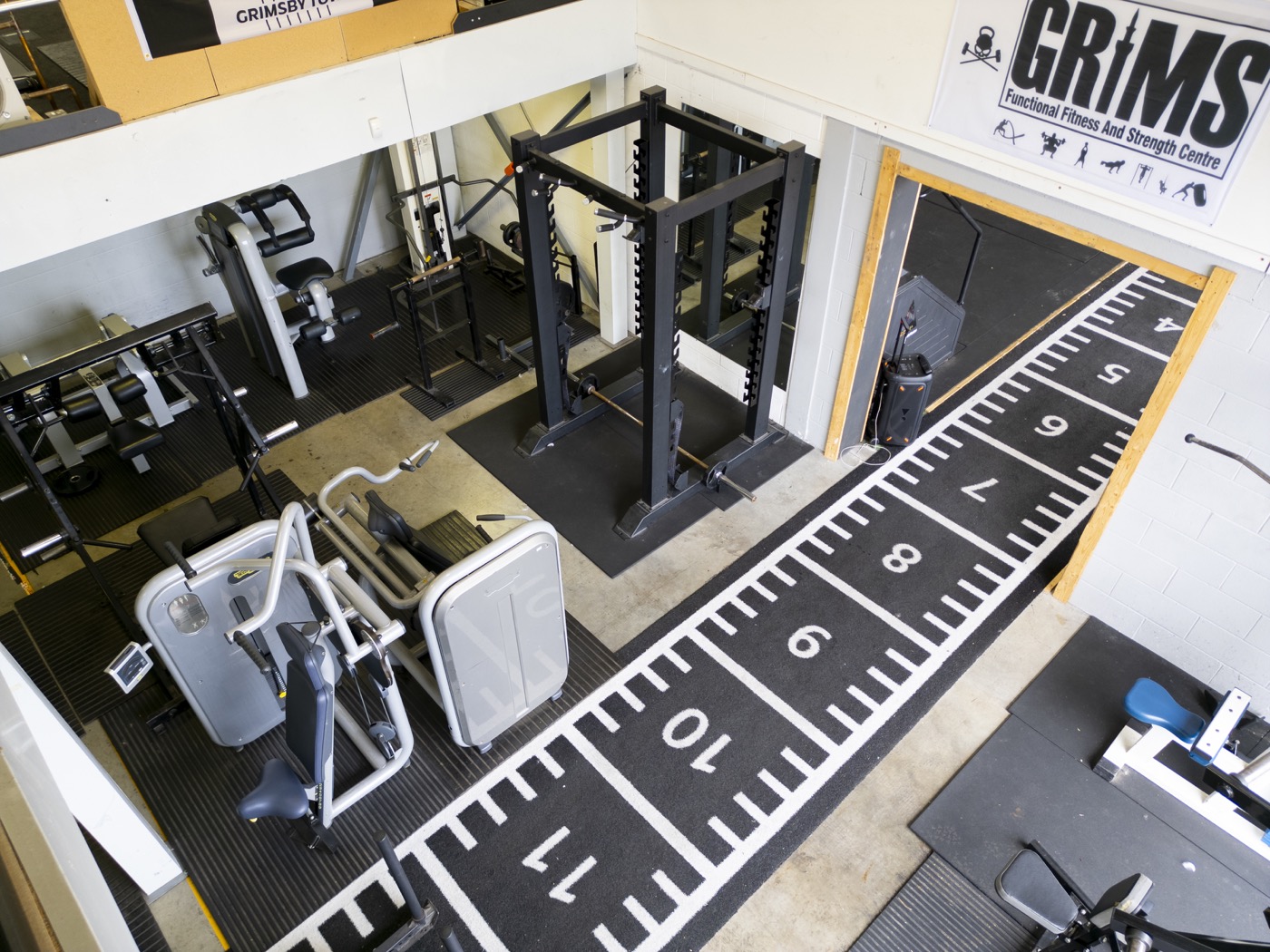 Strength machines and dumbbells line up